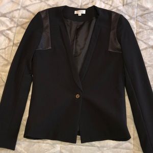 Barney’s black blazer with leather details